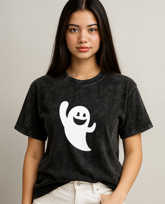 Ghost Mode Acid Wash Oversized T-Shirt - Front view of a woman wearing the distressed black/acid wash oversized t-shirt. The shirt features the centered white ghost graphic. The model is posing against a light gray background.